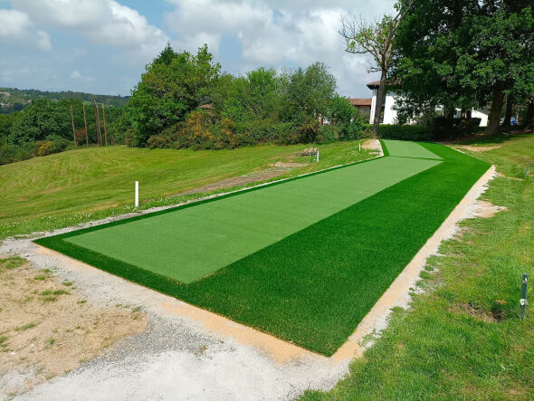 San Francisco Outdoor tee line consisting of one continuous green synthetic grass strip surrounded by trees